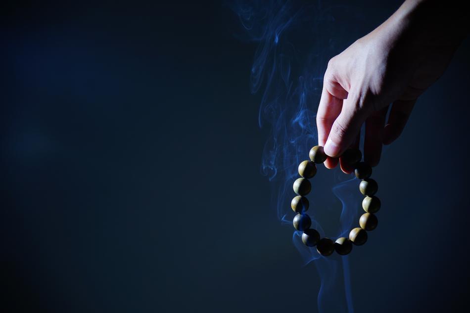 wooden beads in hand