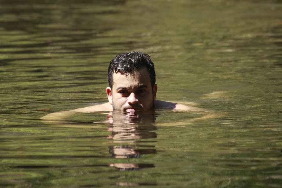 floating man in a river