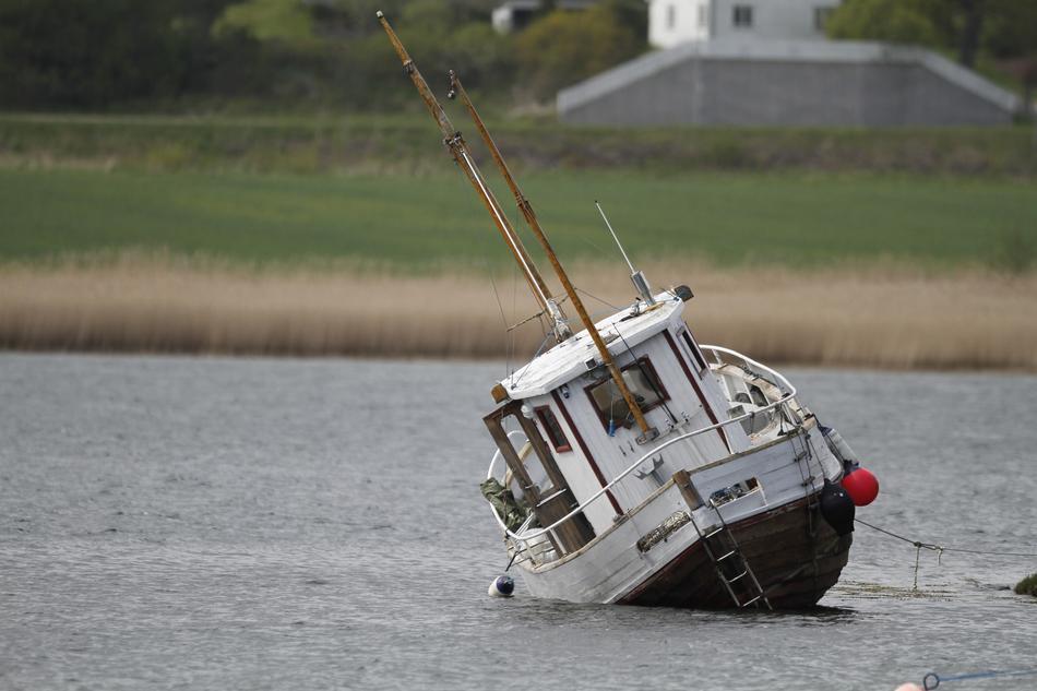 sinking boat in a lake