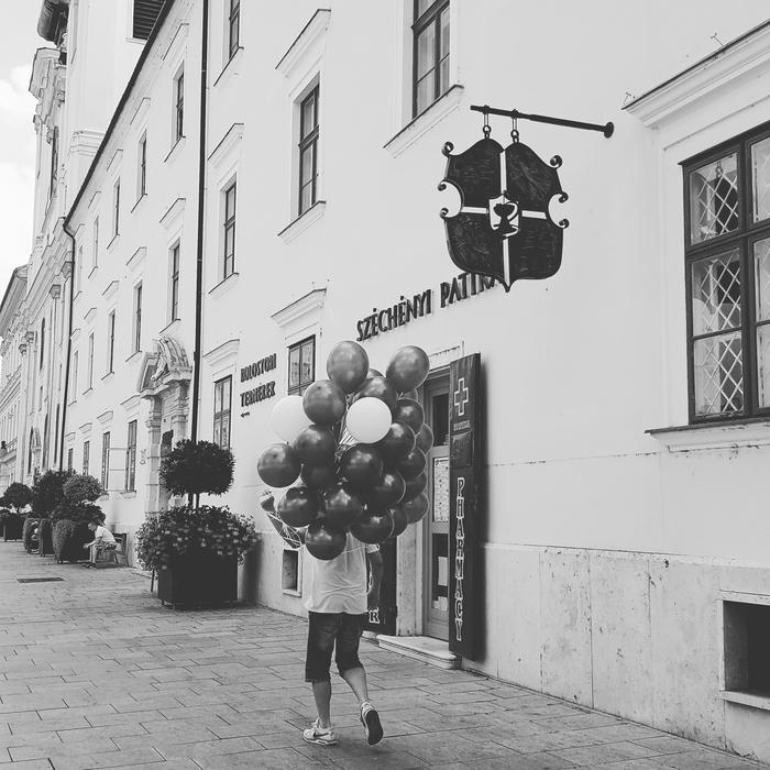 walking man with balloons