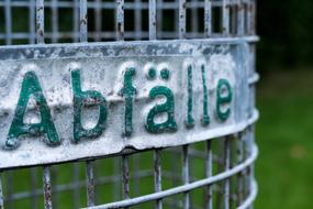 iron vase with green letters