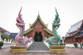colored dragon sculptures at the entrance to the building