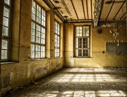a room in an old building lit by light