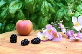 Sweet apple and blackberry on the table