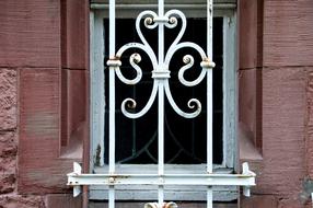 window with white bars in the house