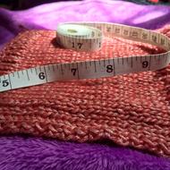 Knitting thread, and measuring tape