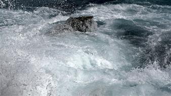 stones, seething ocean waves