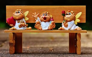 angel figures in a pew