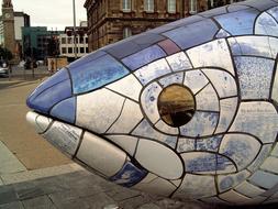 stone fish sculpture in the park