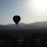 balloon in the air in the fog and mountains