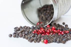 black round pepper sprinkled out of a can