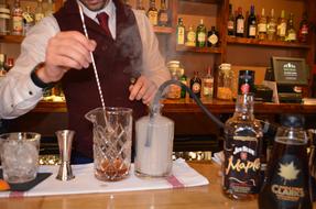 making an alcoholic cocktail at the bar