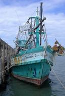 blue ship on the pier