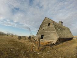 collapsed wooden building on a hill
