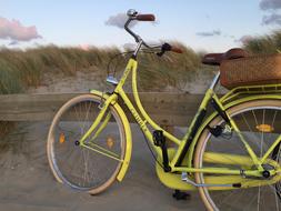 yellow bicycle by the road