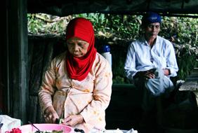 old woman cooks a meal