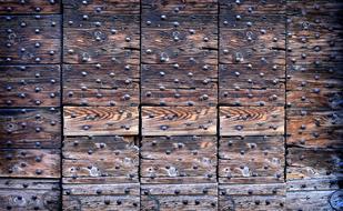 colored wooden wall with nails