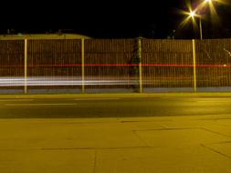 roadside fence at night