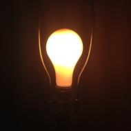 bright light bulb as an idea in the dark