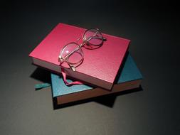 green, red books and glasses