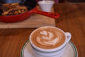 Cappuccino in a chocolate cup