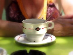 the white cup near the person