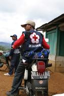 a man on a motorcycle in the village