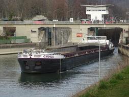 a black ship with a bridge of arches