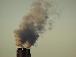 smoke from the chimney against the sky