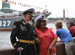 happy couple near the navy at sea