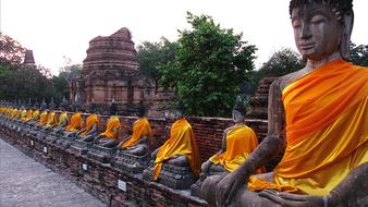 Buddhist sculptures in orange costumes