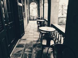 stone balcony with tables and chairs
