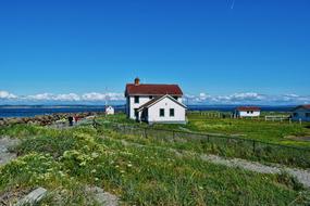 lighthouse and oceanfront building