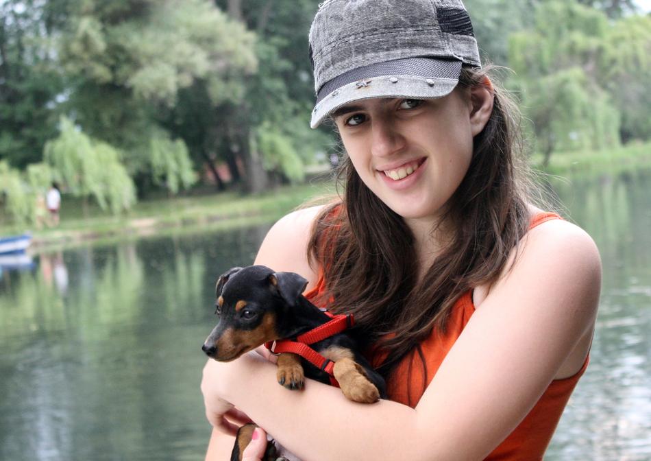 cute girl holding a puppy