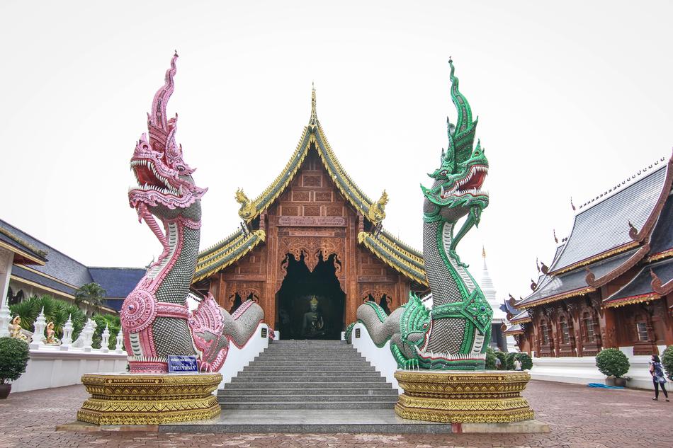 colored dragon sculptures at the entrance to the building