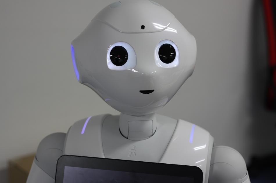 white robot with tablet