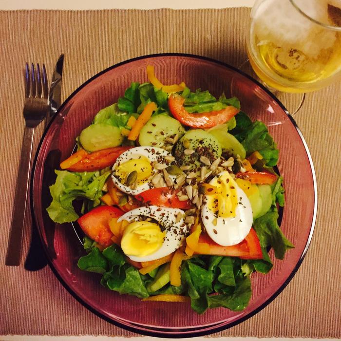 Vegetable salad with eggs and black pepper