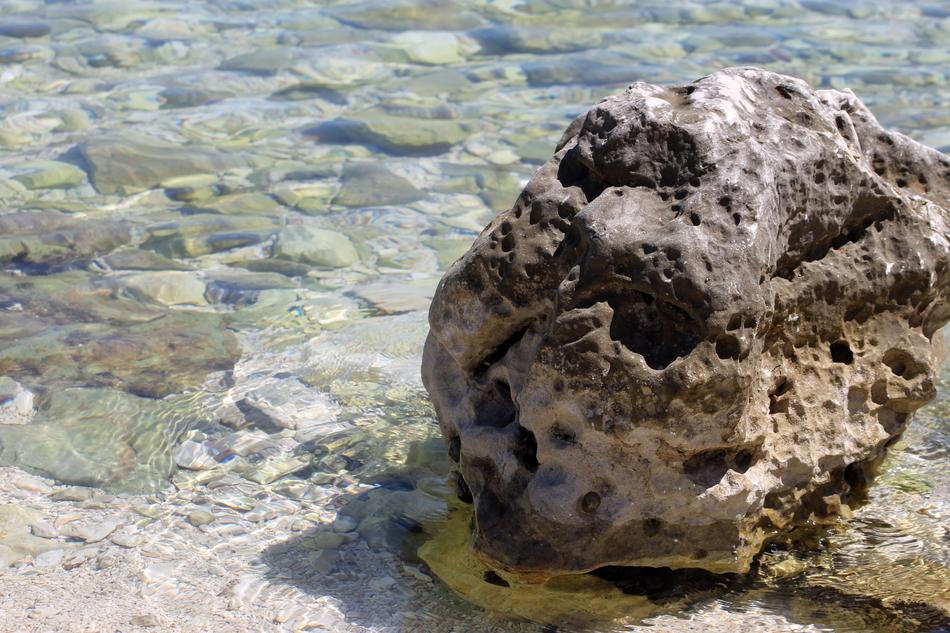 stone with holes in the sea