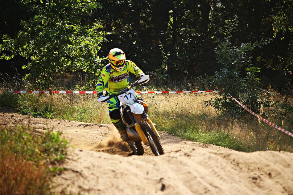 a man on a motorcycle in the sand