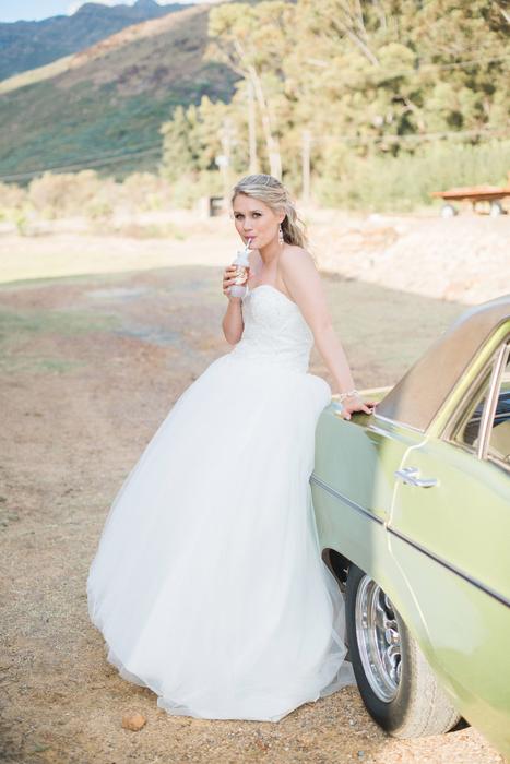 beautiful girl in a wedding dress in a car
