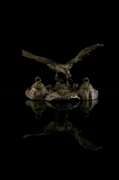 A magnificent sculpture of an eagle on a black background