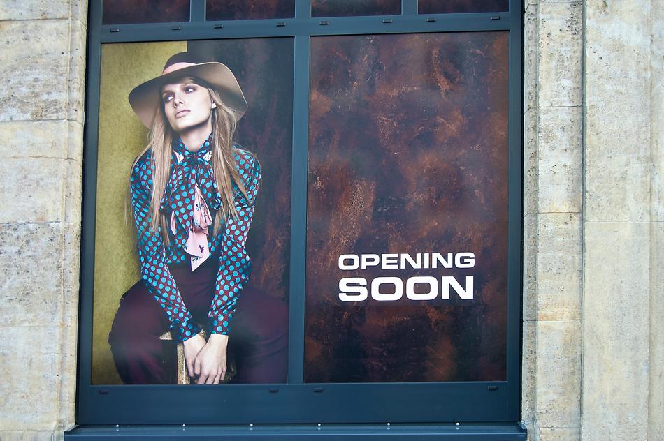 Girl model on a window display poster