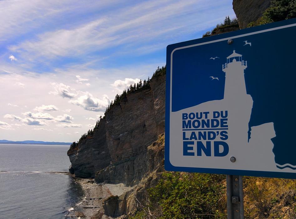 blue sign on the rocks