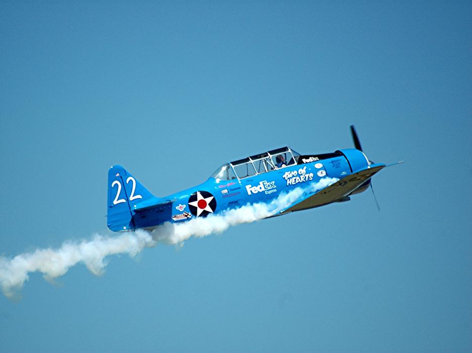 blue plane in the sky