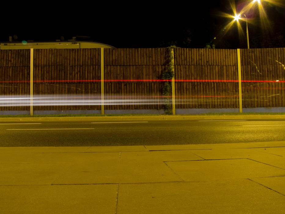 roadside fence at night