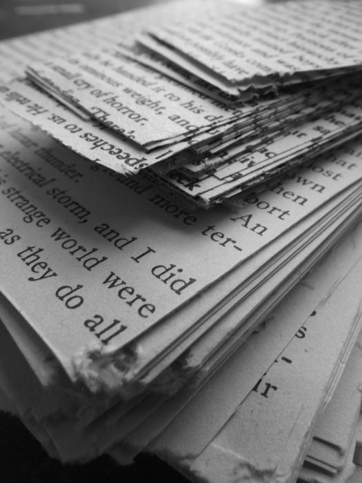 cut sheets of paper with a signature