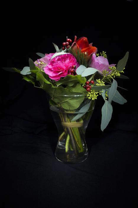 fresh flowers in a vase on a black background