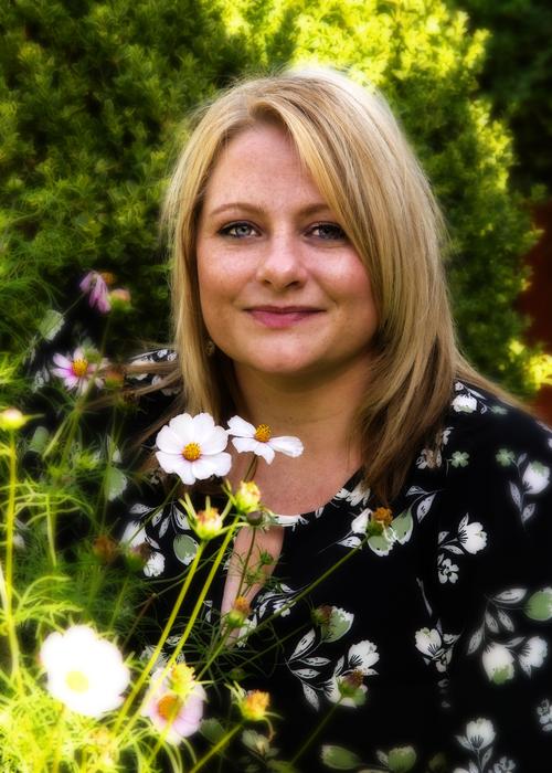 girl in the garden with flowers