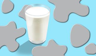 glass of milk on a colored background