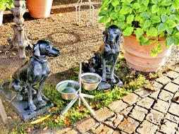 Dog Drinking and Bowls sculpture